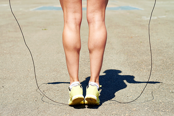 Woman jumping rope outside