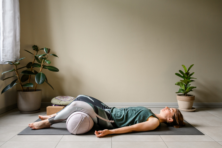 woman in savasana | mantra meaning