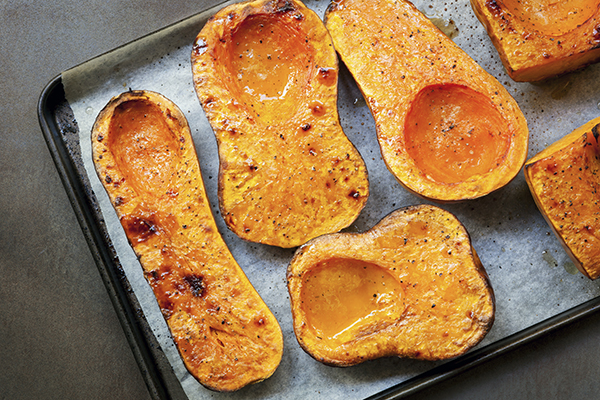 Roasted butternut squash on a sheet pan.