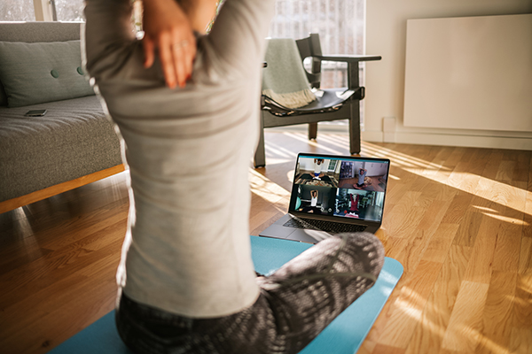 Woman taking online fitness class