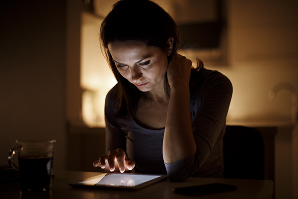 Woman using tablet at home