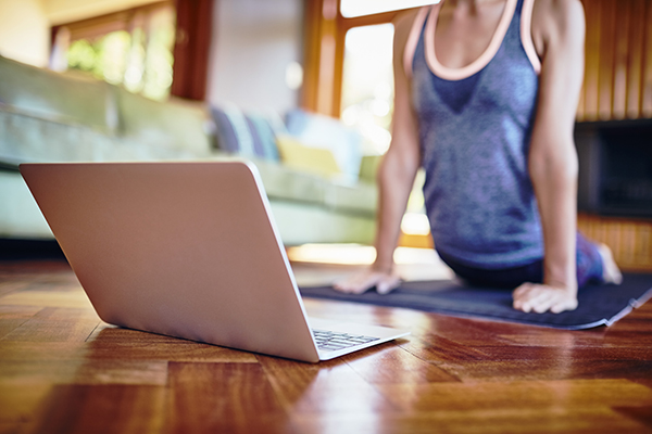 Woman doing yoga stretches at home