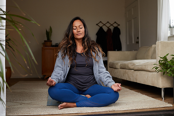 Woman meditating at home