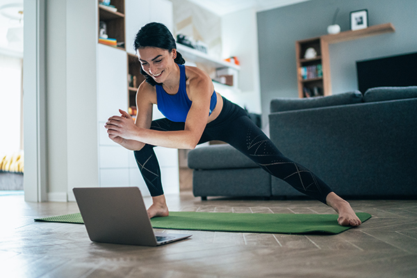 Woman doing zoom workout at home