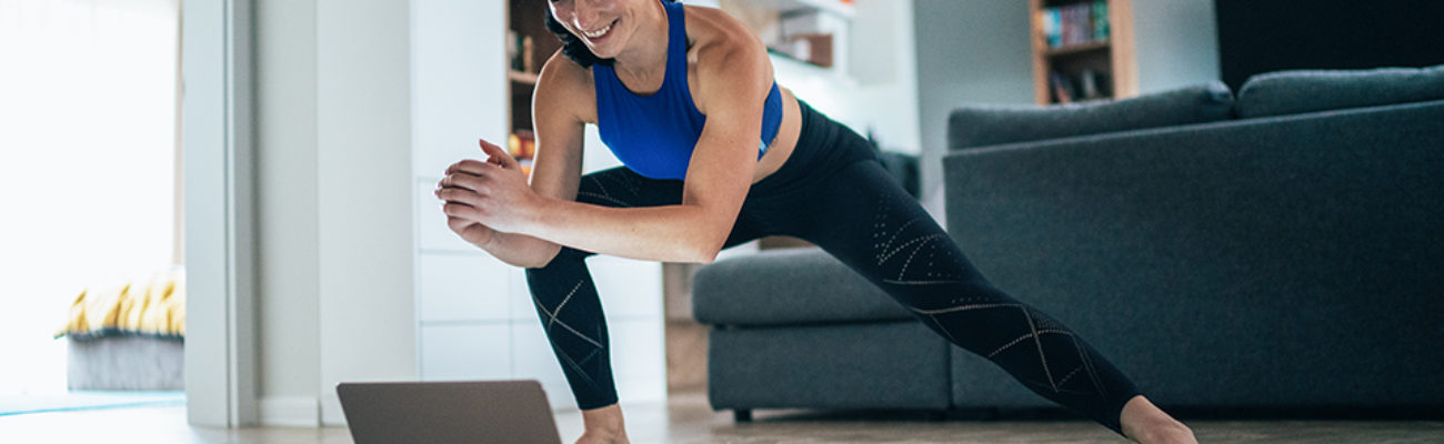 Woman doing zoom workout at home