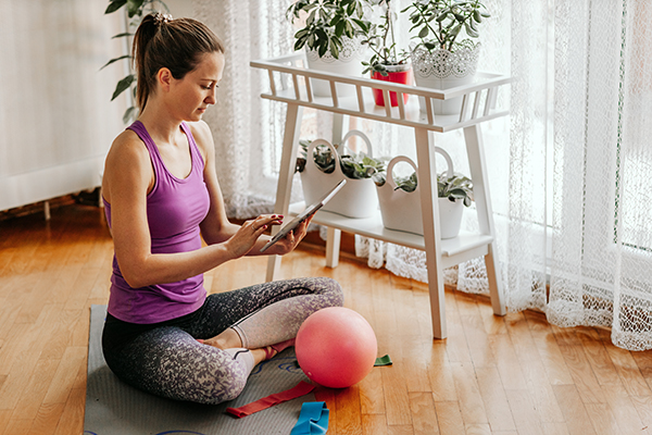 Woman doing zoom workout at home