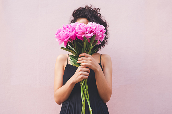 Woman holding bouquet of flowers