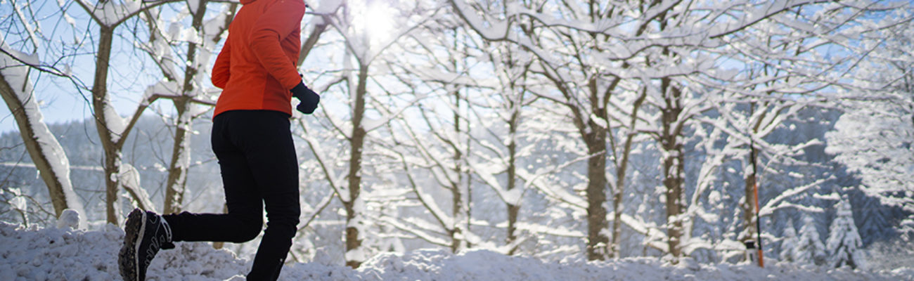 Woman running outside in wintera