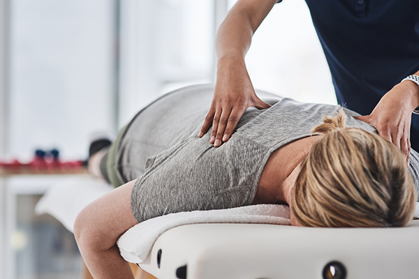 Woman getting professional back massage