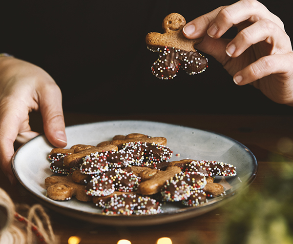 A plate of holiday gingerbread cookies