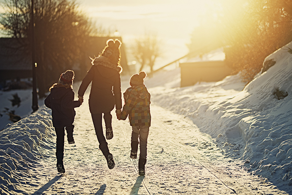 Family running in the snow