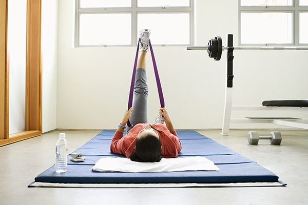 Woman stretching with resistance band