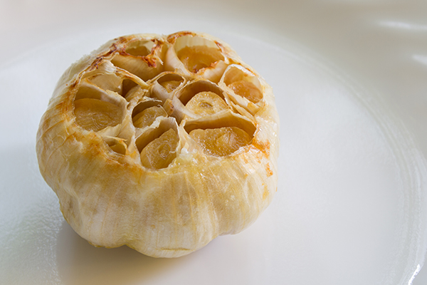 Close up of fresh roasted garlic bulb