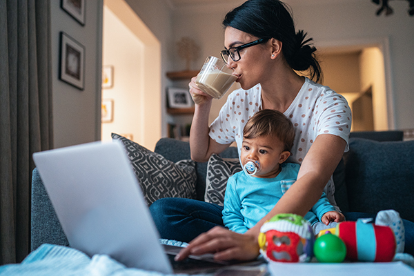 Mom multitasking work and childcare