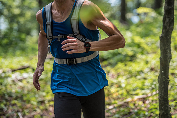 Man running with hydration running vest