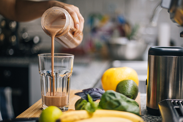 Woman making chocolate Shakeology