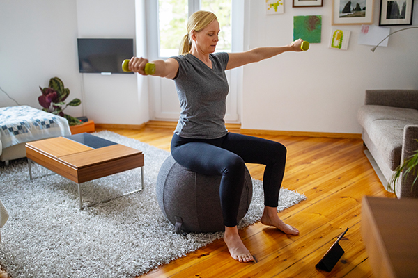 Woman doing streaming workout at home