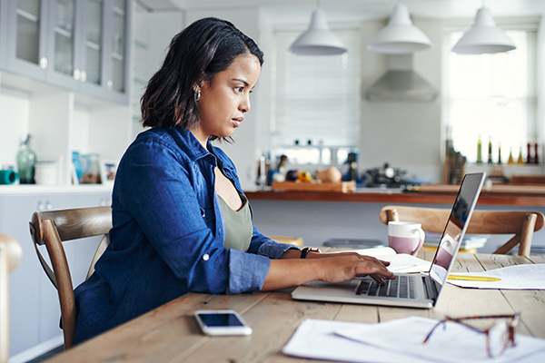 Woman using a laptop while working from home