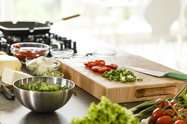 Chopped vegetables on wood cutting board