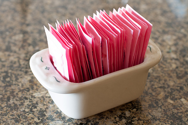 Container with artificial sweetener packets