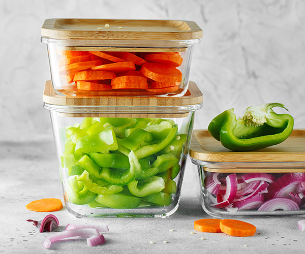 Vegetables in glass freezer containers