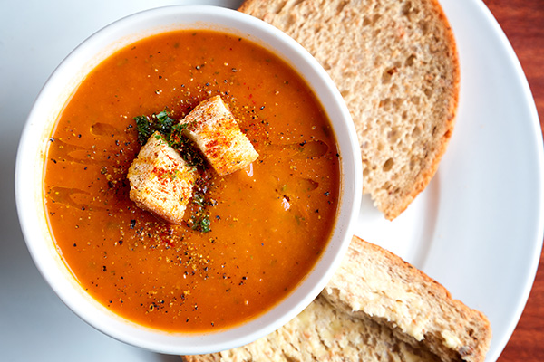 Tomato soup garnished with croutons and parsley