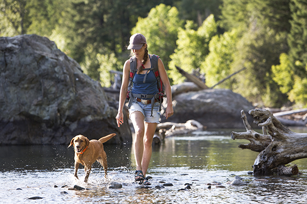 Woman hiking with her dog