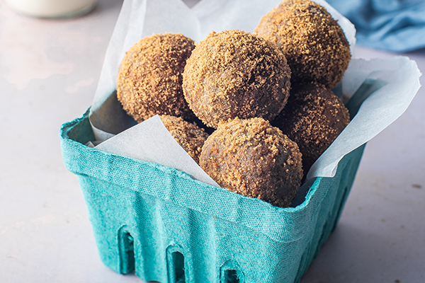 Apple Cider Donut Balls in a cardboard box