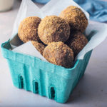 Apple Cider Donut Balls in a cardboard container