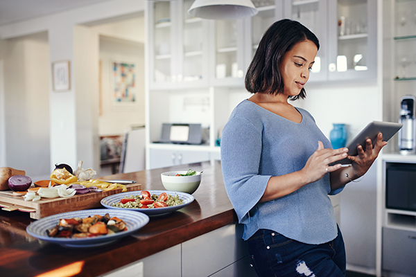 Woman in kitchen preparing meals