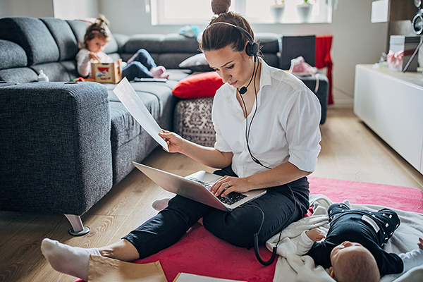 Mom working from home with two kids