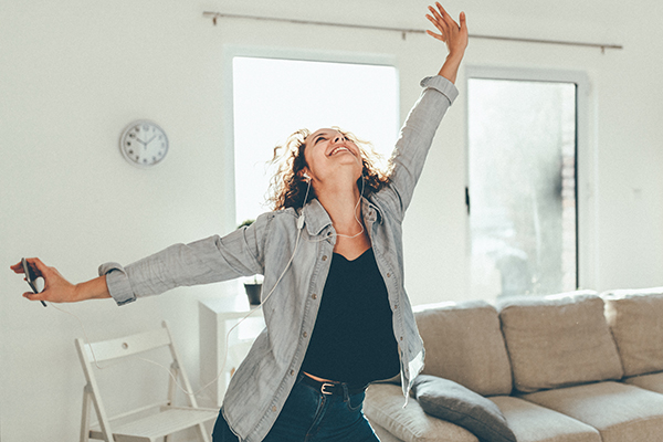 Woman dancing alone at home