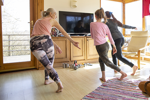 Family doing a dance workout at home