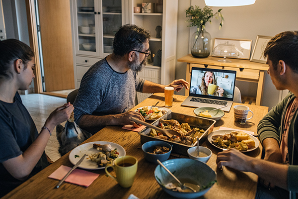 Family eating dinner with mom on Zoom