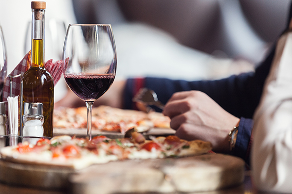 Drinking red wine with pizza