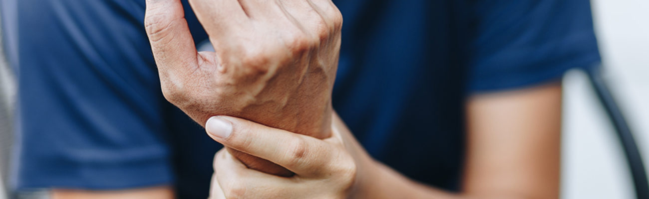 Person holding their own wrist