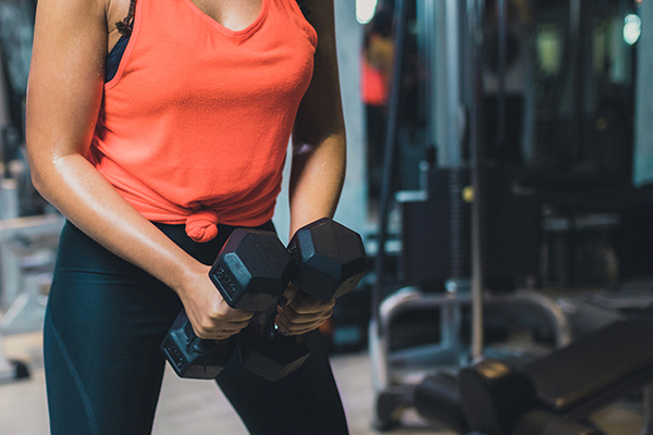 Woman working out with dumbbells