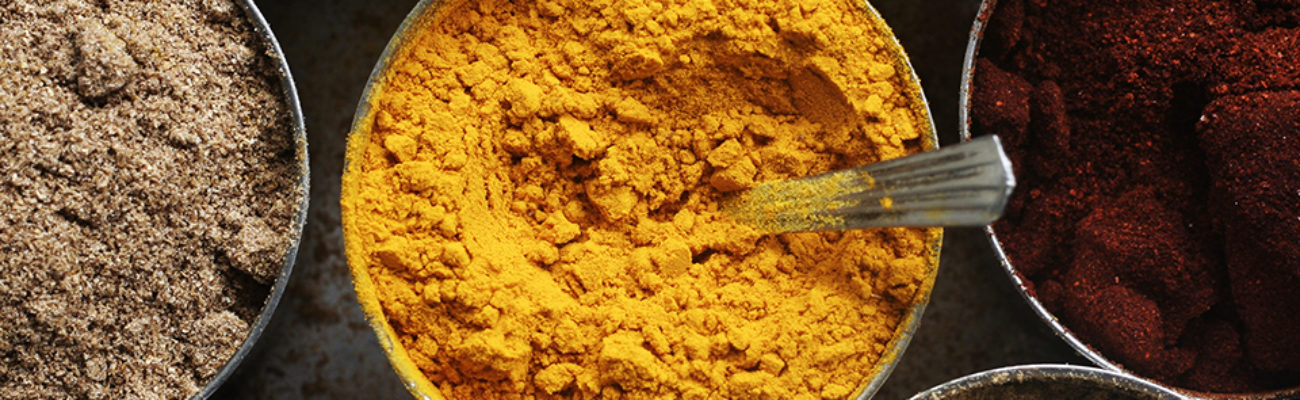 View of Assorted spices in tins from above.