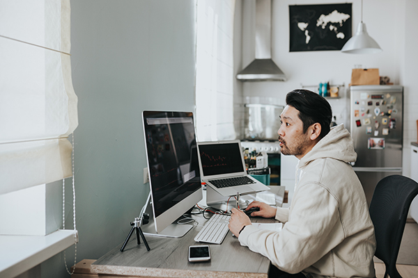 Man sitting at computer working from home