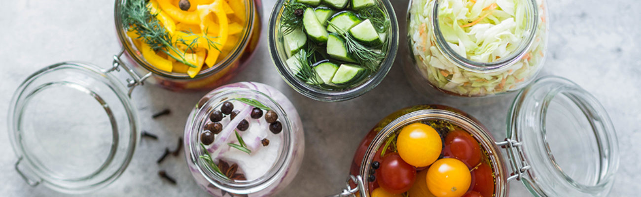 Pickled vegetables in glass jars