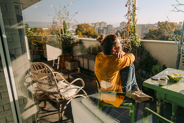 Woman relaxing outdoor on patio.