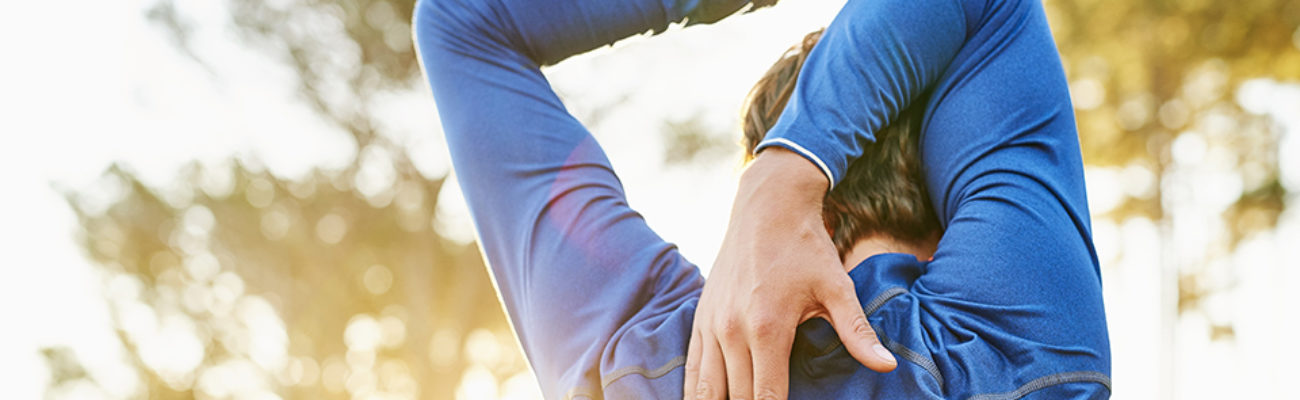 Man doing active triceps stretch