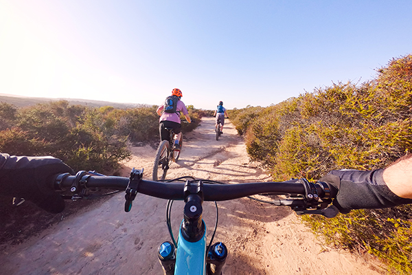 POV of person riding a bike outdoors on trail