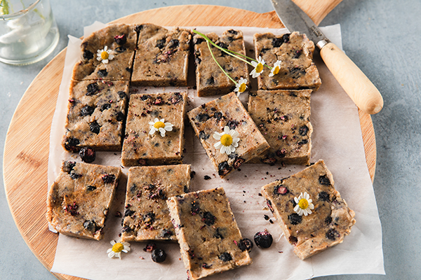 Shakeology No Bake Blueberry Pie Bars on a cutting board