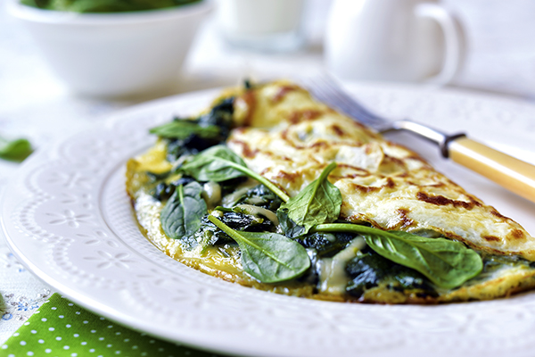 Omelette stuffed with spinach and cheese