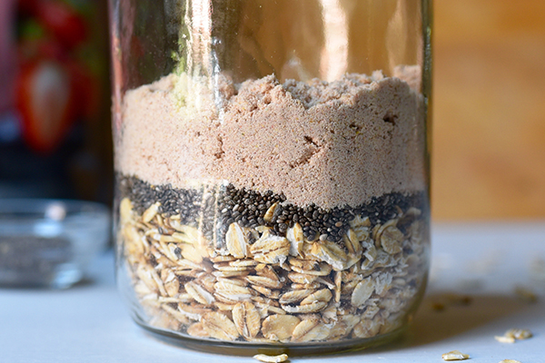 Side view of overnight oats mixture in a jear
