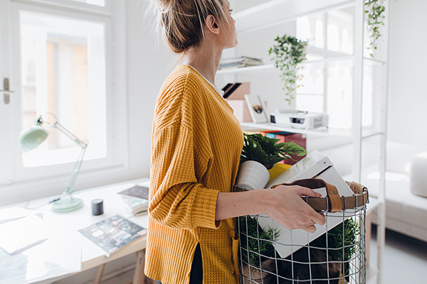 Woman cleaning her desk at home