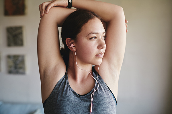 Woman stretching her arms before workout