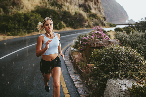 Woman doing interval running on road