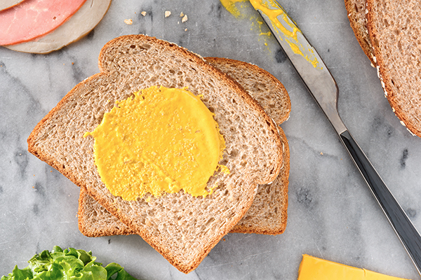 Wheat bread with smear of mustard